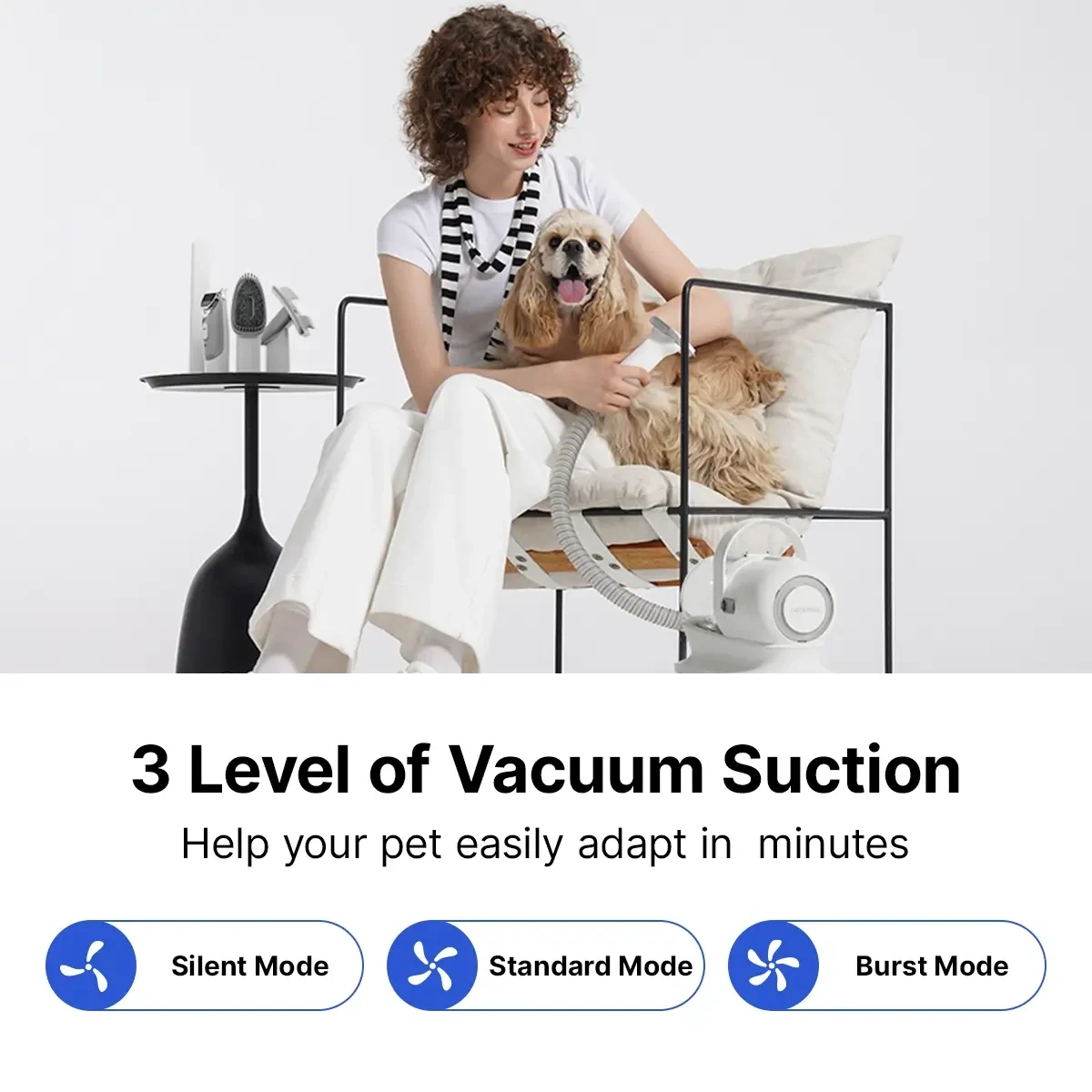 Neakasa P1 Pro pet grooming vacuum in use with its grooming tools nearby
